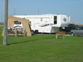 an RV in the campsite at Galveston Island State Park